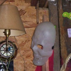 This is a picture of the mask that came off the wall. You can see the top of the sticks that it was hanging on. It levitated that high to come off the wall!